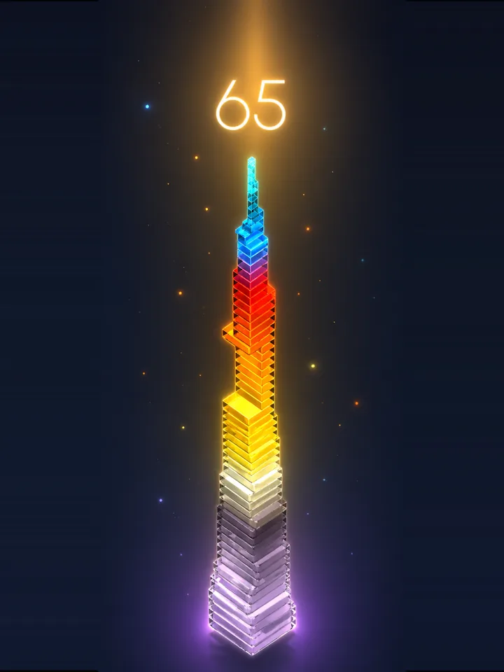 Schermata di gioco: torre di blocchi luminosi e punteggio 65